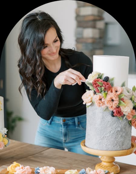 Instructor cutting decorated cake